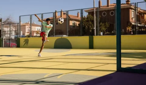 portrait-young-man-playing-football